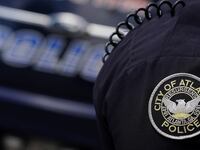 The Atlanta Police Department logo is seen on an Atlanta Police Department officer