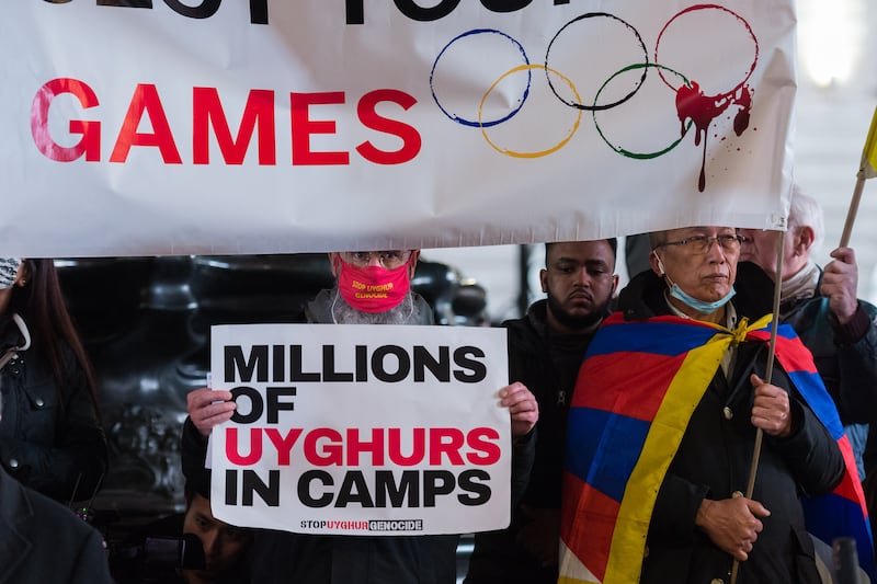 LONDON, UNITED KINGDOM - FEBRUARY 03, 2022: Hongkongers, Tibetans, Uyghur Muslims, their Tigrayan allies and supporters protest in Piccadilly Circus on the eve of Beijing 2022 Winter Olympic Games on February 03, 2022 in London, England. The demonstrators protest against the International Olympics Committee's (IOC) decision to award this year's Winter Olympics to China amid the country's record of human rights violations in Hongkong and Tibet as well as crimes against humanity against Uyghurs and other Turkic Muslims in the northwestern region of Xinjiang. (Photo credit should read Wiktor Szymanowicz/Future Publishing via Getty Images)