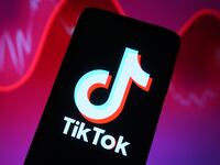 In this photo illustration, a TikTok logo is seen displayed on a smartphone screen.
