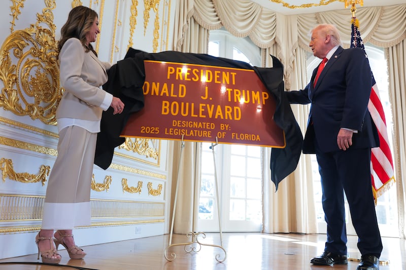 Florida State Rep. Meg Weinberger (L) and U.S. President Donald Trump unveil a "President Donald J. Trump Boulevard" sign during a Road Dedication Ceremony at Mar-a-Lago on January 16, 2026 in Palm Beach, Florida. Florida State lawmakers approved the name change of a portion of Southern Boulevard to “President Donald J. Trump Boulevard.”