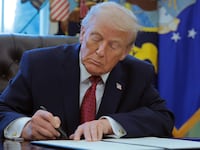 WASHINGTON, DC - DECEMBER 15: U.S. President Donald Trump signs an executive order classifying fentanyl as a "weapon of mass destruction," during a ceremony for the presentation of the Mexican Border Defense Medal in the Oval Office of the White House on December 15, 2025 in Washington, DC. During the ceremony, Trump recognized the first 13 service members to receive the recently established Mexican Border Defense Medal (MBDM), which recognizes service members supporting Customs and Border Protection on the U.S.-Mexico border. (Photo by Anna Moneymaker/Getty Images)