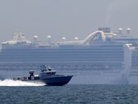 A patrol boat sails past the Princess Cruises' Ruby Princess cruise ship as it docks in Manila Bay during the spread of the coronavirus disease (COVID-19), in Cavite city, Philippines, May 7, 2020.