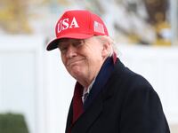 US President Donald Trump smiles as he walks from Marine One to the White House after landing on the South Lawn in Washington, DC, on November 22, 2025. Trump is returning to the White House after taking an aerial tour of The Courses at Joint Base Andrews, Maryland. (Photo by Alex WROBLEWSKI / AFP via Getty Images)