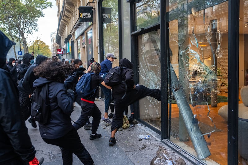 PARIS, FRANCE - OCTOBER 17: A shop is vandalised and looted during demonstrations on October 17, 2026 in Paris, France. The involvement of the Gilets Jaunes (Yellow Vests) with the ongoing French school blockades expands the scope of these demonstrations by linking localised student grievances to broader economic policies. Student unions originally initiated the movement to protest underfunding, deteriorating infrastructure, and acute teacher shortages across French high schools and universities. By joining the protests, the Gilets Jaunes introduce their established platform against austerity cuts, rising living costs, and surging fuel prices into the youth-led action. (Photo by Carl Court/Getty Images)