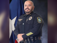 Daniel Rodriguez smiles in a headshot.