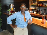 Whiskey_Blender_Eboni_Major_Raises_a_Glass_to_the_Opening_of_the_New_Bulleit_Distilling_Co._Visitor_Experience_copy_jwj2ys