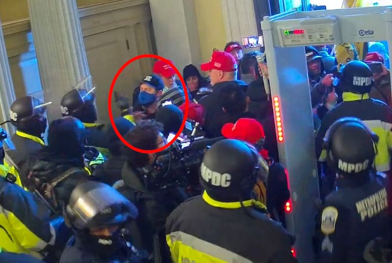 A court exhibit showing a still from a security camera with suspect Austin Harris circled in red