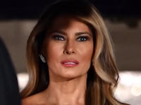 U.S. First Lady Melania Trump, accompanied by President Donald Trump, waits for the arrival of the Crown Prince and Prime Minister of the Kingdom of Saudi Arabia Mohammed bin Salman prior to a state dinner at the White House in Washington, DC on November 18, 2025.