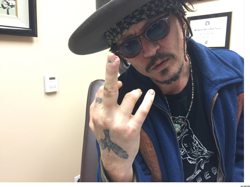 220523-depp-finger-embed-WARNING_kqo54c
