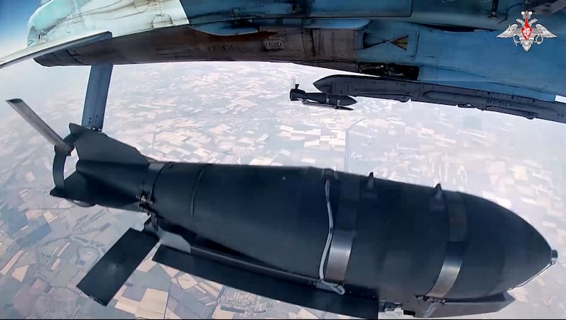 UNSPECIFIED - JULY 24: (----EDITORIAL USE ONLY - MANDATORY CREDIT - 'RUSSIAN MINISTRY OF DEFENSE / HANDOUT' - NO MARKETING NO ADVERTISING CAMPAIGNS - DISTRIBUTED AS A SERVICE TO CLIENTS----) A screen grab taken from a video released by Russian Defense Ministry shows SU-34 fighter jet of Russian Air Force dropping unguided FAB-500 bombs on Ukrainian positions on July 24, 2024. (Photo by Russian Ministry of Defense/Anadolu via Getty Images)