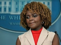 White House Press Secretary Karine Jean-Pierre listens during the daily briefing
