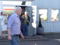 WikiLeaks founder Julian Assange walks to board a plane at a location given as London, Britain, in this still image from video released June 25, 2024.