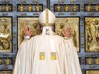 Pope Francis opens the Holy Door of St. Peter's Basilica on December 8, 2015 in Vatican City, Vatican. During the solemnity of the Immaculate Conception of the Blessed Virgin Mary, Pope Francis solemnly inaugurated the Jubilee Year of Mercy with the celebration of the Holy Sacrifice of the Mass. This Extraordinary Holy Year is itself a gift of grace,' the Pope said in his homily. (Photo by Vatican Pool/Getty Images)