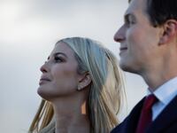 Ivanka Trump and Jared Kushner watch on during an outdoor speech