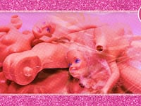 A photo illustration of broken Barbie doll parts.