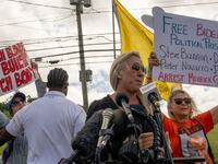 Rep. Marjorie Taylor Greene speaks outside the prison where Steve Bannon turned himself in.