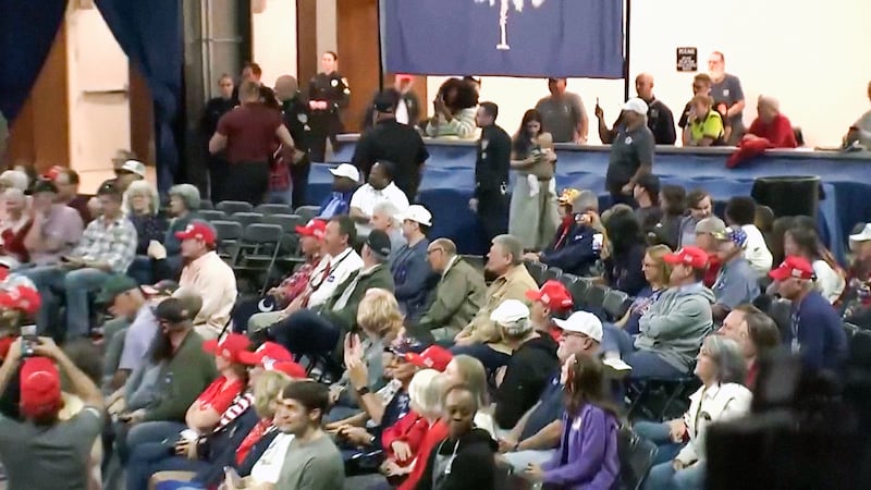 A protester is kicked out of Trump's rally in Rock Hill, South Carolina, revealing empty seats in the audience on Oct. 29, 2026.