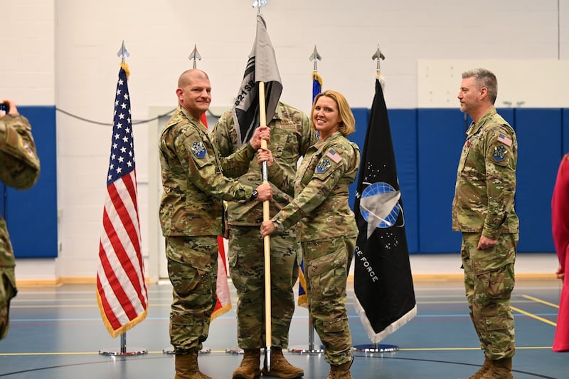 Colonel Susan Meyers assumes command of the 821st Space Base Group in July during a flag ceremony with three other officers.