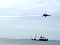 The U.S. Navy’s elite Blue Angels squadron is reviewing one of its own jets after it roared so low over a Florida beach that it sent chairs and umbrellas flying.