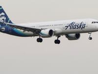 An Alaska Airlines plane prepares to land.