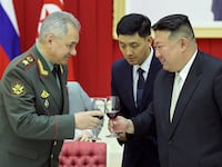 Russia's Defense Minister Sergei Shoigu toasts a glass with North Korean leader Kim Jong Un.