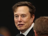 Tesla CEO Elon Musk attends the public memorial service for right-wing activist Charlie Kirk at State Farm Stadium in Glendale, Arizona, on September 21, 2025.