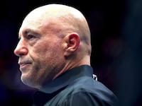 NEWARK, NEW JERSEY - JUNE 07: Joe Rogan looks on during UFC 316 at the Prudential Center on June 07, 2025 in Newark, New Jersey. (Photo by Elsa/Getty Images)