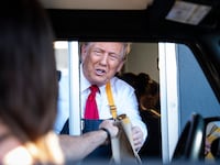 Feasterville-Trevose, PA - October 20 : Republican presidential nominee former President Donald Trump hands out food while standing at a drive-thru window during a campaign stop at a McDonald's in Feasterville-Trevose, PA on Sunday, Oct. 20, 2024. (Photo by Jabin Botsford/The Washington Post via Getty Images)