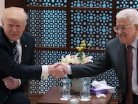 Donald Trump shakes hands with Palestinian leader Mahmud Abbas during a meeting at the presidential palace in the West Bank city of Bethlehem on May 23, 2017.
