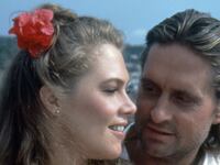 Kathleen Turner and Michael Douglas get close on the set of "Romancing the Stone."