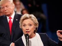Democratic nominee Hillary Clinton (R) and Republican Presidential nominee Donald Trump participate in a town hall debate at Washington University in St. Louis, Missouri, on October 9, 2016.