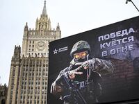 Russian Foreign Ministry building is seen behind a social advertisement billboard showing Z letters - a tactical insignia of Russian troops in Ukraine