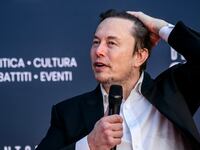 Elon Musk speaks at a conference in Italy.