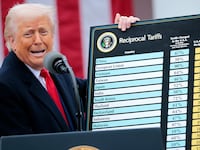 President Donald Trump holds up a chart while speaking during a “Make America Wealthy Again” trade announcement event in the Rose Garden at the White House on April 2, 2025 in Washington, DC.