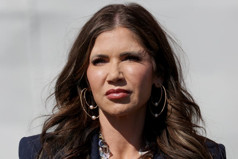 Department of Homeland Security Secretary Kristi Noem looks on during a press conference. On Sunday a thief stole her $4,000 designer handbag.