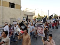 articles/2013/10/16/libya-eyes-funding-al-liby-defense-in-terrorism-trial/131016-dettmer-al-libi-tease_ezk2er