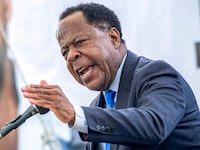 Leo Terrell, Chair of the US Department of Justice Task Force to Combat Antisemitism and Senior Counsel, speaks during the funeral of Israeli hostage Ran Gvili, whose remains were finally brought back to Israel on January 26, in the southern town of Meitar on January 28, 2026. Hundreds of tearful mourners packed a stadium in southern Israel on January 28, 2026, for the funeral of Ran Gvili, the last Gaza hostage whose burial marks the end of a painful national saga triggered by Hamas's 2023 attack. Israeli forces on January 26 brought home the remains of Gvili, who was killed in action and whose body Palestinian militants took into Gaza during their October 7 attack, which triggered a devastating two-year war. (Photo by Chaim Goldberg / POOL / AFP via Getty Images)