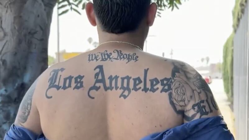 "We the people" tattooed across Gavidia's back.