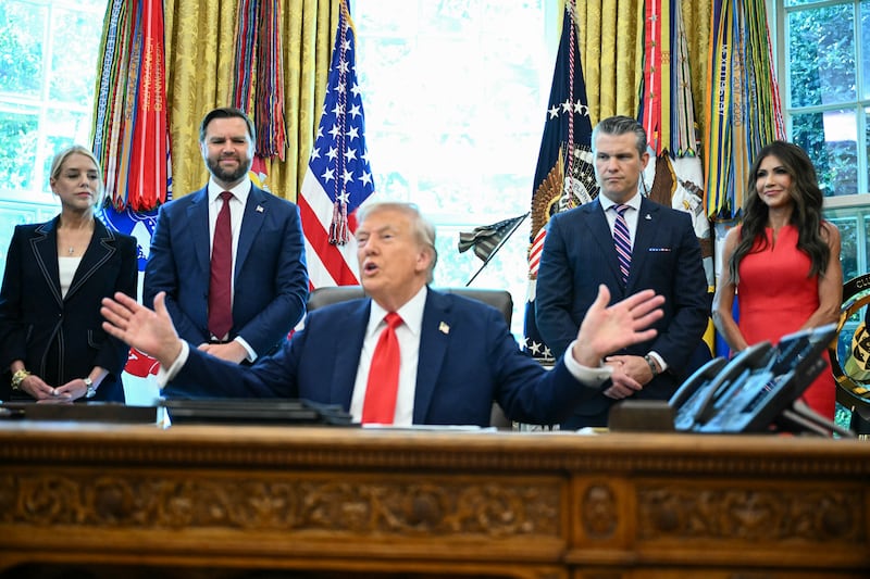 Attorney General Pam Bondi, Vice President JD Vance, Defense Secretary Pete Hegseth and Secretary of Homeland Security Kristi Noem look on as US President Donald Trump speaks to the press before signing an executive order that aims to end cashless bail, in the Oval Office of the White House in Washington, DC on August 25, 2025.
