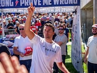 OREM, UTAH - SEPTEMBER 10: Charlie Kirk throws hats to the crowd after arriving at Utah Valley University on September 10, 2025 in Orem, Utah. Kirk, founder of Turning Point USA, was speaking at his "American Comeback Tour" when he was shot in the neck and killed. (Photo by Trent Nelson/The Salt Lake Tribune/Getty Images)