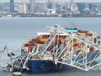 The frame of the Francis Scott Key bridge in Baltimore sits on top of the cargo ship Dali after the collapse.