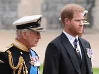 King Charles III walks with Prince Harry as they arrive at St George’s Chapel inside Windsor Castle on September 19, 2022.