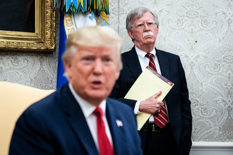 John Bolton listens as President Donald Trump in the Oval Office at the White House on July 18th, 2019 in Washington, DC.