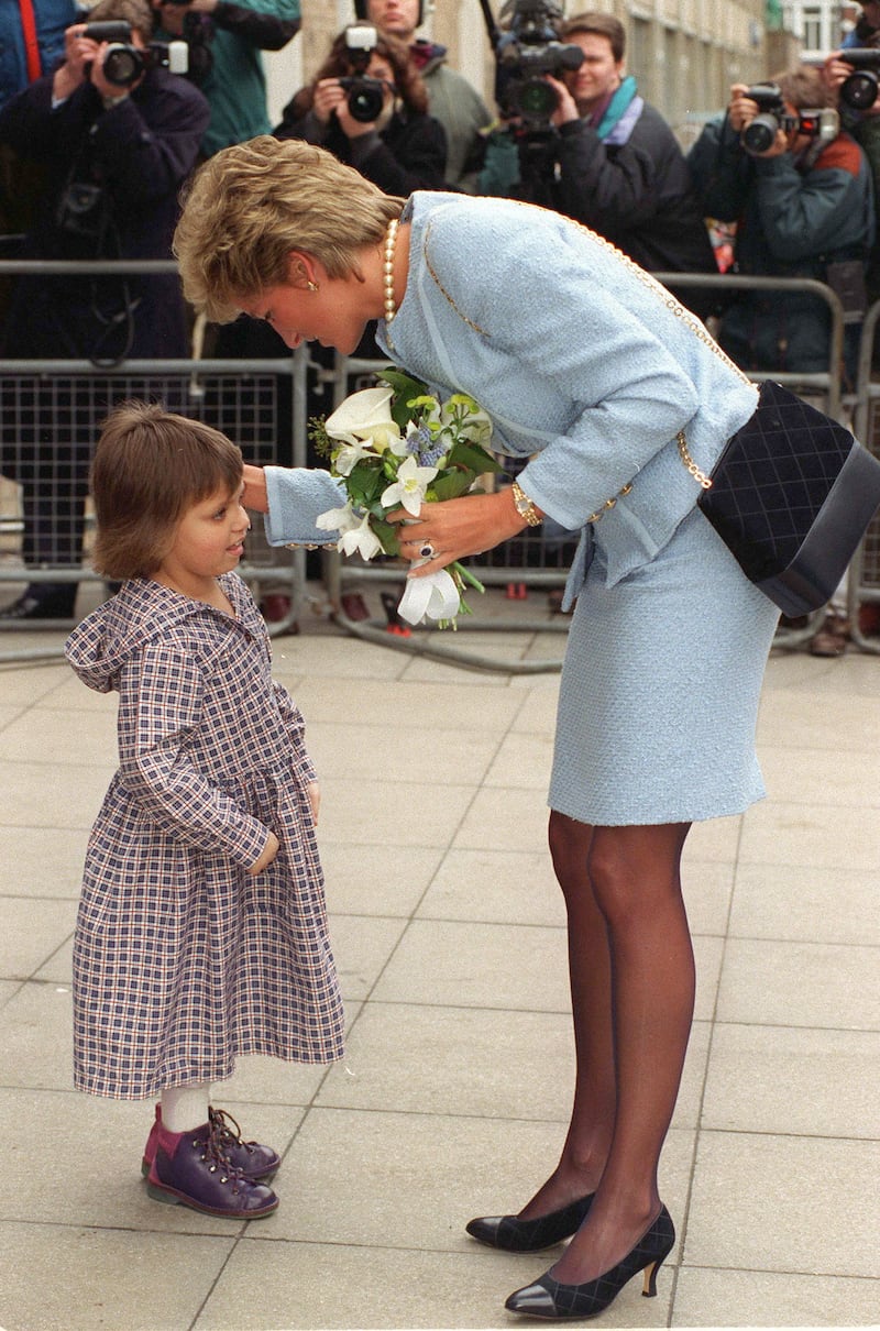 Diana, Princess of Wales, visits the Great Ormond Street Hospital for Children in London. She Is Wearing A Pale Blue Louis Feraud Boucle Suit.