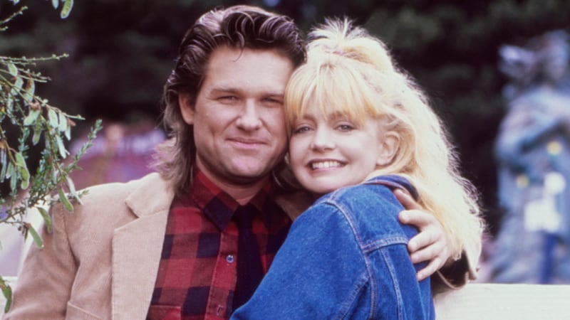 While shooting the movie "Overboard", actors Goldie Hawn and Kurt Russell pose for a portrait in October 1987 in Fort Bragg, California.