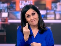 Anchor holds up middle finger in pixelated image