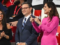 Speaker of the House Mike Johnson and U.S. Rep. Nancy Mace share a laugh on the third day of the Republican National Convention last July.