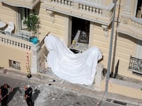 TOPSHOT - Members of a bomb disposal team operate the day after an allaged attack involving an explosive device in the lobby of a residential building, in Monaco on June 30, 2026. Law enforcement officers were deployed on the morning of June 30, 2026, in Monaco and the surrounding area in an attempt to track down the suspect in the parcel bomb explosion that rocked the principality on the evening of June 29, 2026 seriously injuring a Ukrainian oligarch and two of his relatives. (Photo by Valery HACHE / AFP via Getty Images)