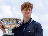 Jannik Sinner of Italy poses with the trophy during the Australian Open winner photo shoot at the Albert Park Lake, in Melbourne, Australia, Jan. 27, 2025. (Photo by Chu Chen/Xinhua via Getty Images)