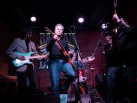 US Secretary of State Antony Blinken performs "Rockin' in the Free World" with members of The 1999 band at the Barman Dictat bar in Kyiv.